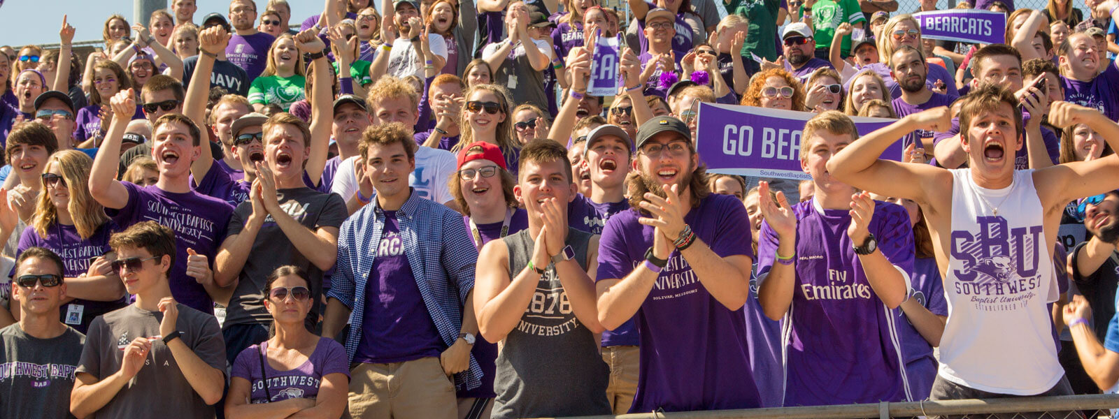 students cheering during Homecoming bed races