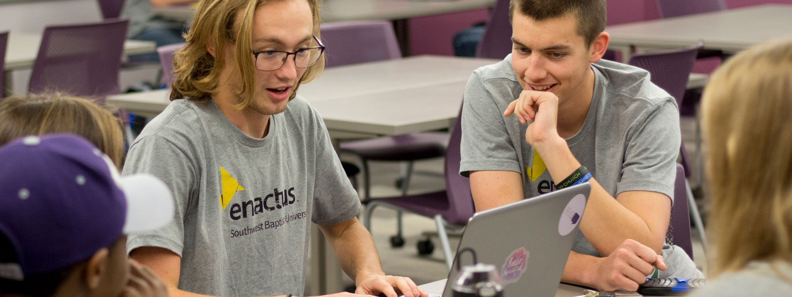 students cheering at football stadium