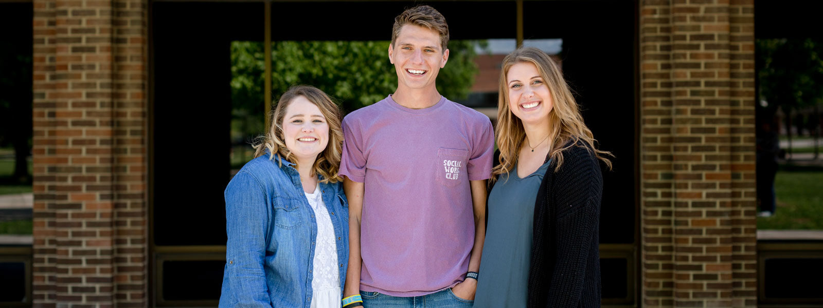 students walking with dorm float in Homecoming parade